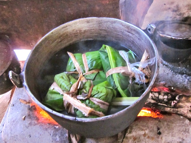 Nacatamales cooking over fire